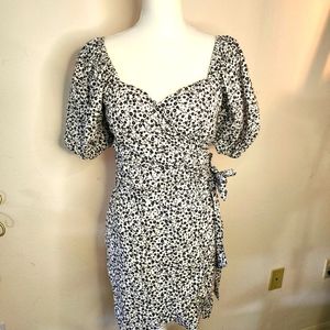 Dress-wrap around, lined, sash ties at waist. Puff sleeves.